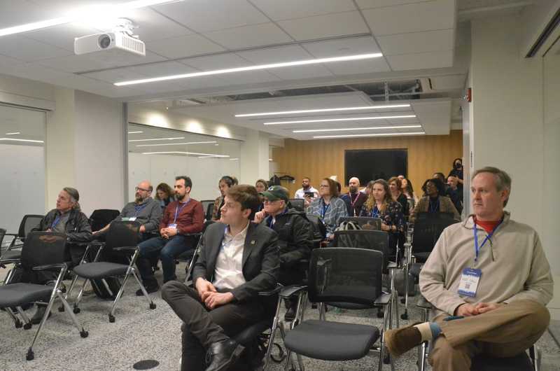 Event attendees listening in to the keynote conversation by Bixal CEO Carla Briceno.